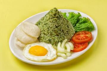 Nasi goreng cabe hijau. Green fried rice is a Indonesian fried rice that is green in color because it uses green chilies its main seasoning.