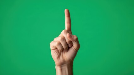 Hand showing one finger on green screen