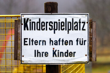 Fototapeta premium German playground warning sign emphasizing parental responsibility