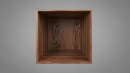 Empty wooden cube interior viewed from above against a neutral gray background creating depth and focus