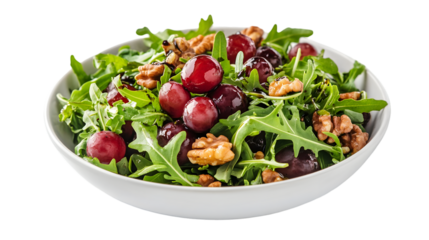 Fresh arugula salad with sweet red grapes and crunchy walnuts drizzled with balsamic glaze in a white bowl