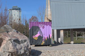 Naklejka premium looking north from Trillium Park with boulder, boxcar trailer, shed, and Hotel X (Ontario Place, 955 Lake Shore Blvd W) Toronto