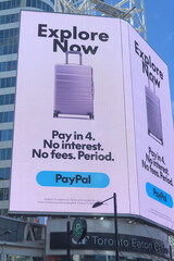 Fototapeta premium digital billboard facing Sankofa Square featuring PayPal advertising, Toronto