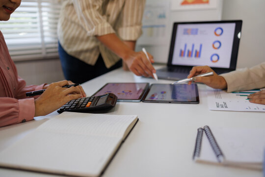 Business team have a discussion on financial report, business analyzing marketing data at office. Bookkeeping, document for financial planning, accounting and business budget management, close up

