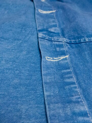 blue jeans texture Closeup, macro of blue jeans denim fabric texture background. Diagonal weaving jean cloth, canvas. Textile for decor, upholstery, garment. Wallpaper, backdrop.