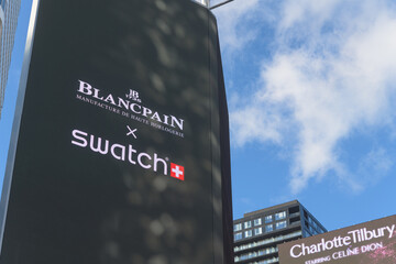 Naklejka premium close-up of digital advertisement featuring Swatch x Blancpain collaboration facing Sankofa Square, Toronto