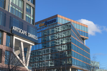 Fototapeta premium ghost signs of Artscape Daniels Launchpad still visible at 130 Queens Quay E, and theScore, a media company, at 125 Queens Quay E, Toronto