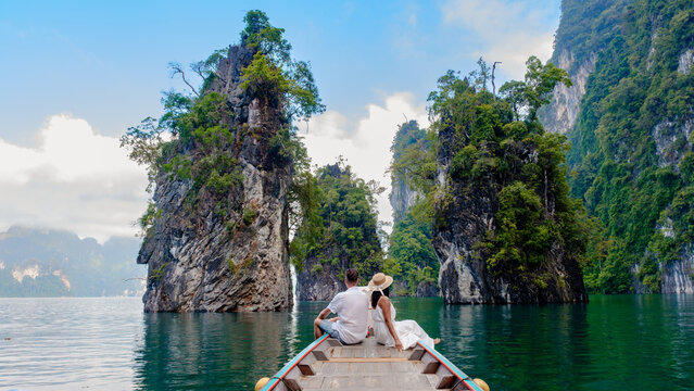 Explore the serene beauty of Cheow Lan Lake in Khao Sok, Thailand with a romantic boat experience