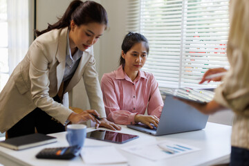 Business meeting. analyst team utilizing BI Fintech to analyze financial report with laptop. Businesspeople analyzing BI data dashboard displayed on laptop screen for business insight. Prodigy
