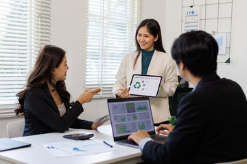 ESG Project with Business Meeting on ESG. Professionals analyzing sustainability metrics and strategies in an office.
