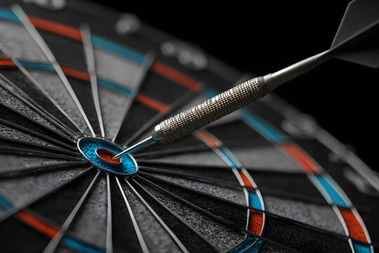 The dart must hit the center of the target on a black background