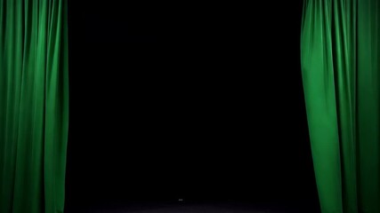 A cinematic video sequence showing a rich, dark green velvet theater curtain fully drawn slowly parting to reveal a completely empty black stage background, symbolizing the beginning of a show, a reve