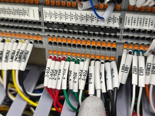 Labeled Electrical Wires Connected to Terminal Block, Close-Up View