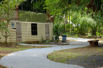 Curved Concrete Path Leading Past Lodge Building in Green Park
