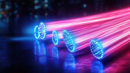 Close-up view of glowing multicolored fiber optic cables emitting bright pink and blue light beams on a dark reflective surface