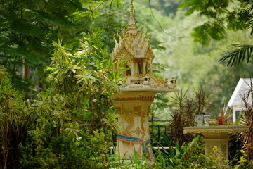 Golden Spirit House in Lush Tropical Garden, Thai Cultural Shrine