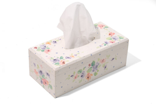 White wooden tissue box featuring a colorful floral painting, isolated on a white background