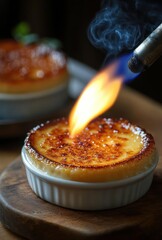 close-up of caramelizing sugar topping on creamy dessert with a blue flame torch creating a warm, inviting atmosphere