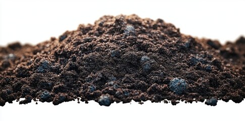 close-up mound of dark potting soil with scattered blue fertilizer granules on white background conveying rich, earthy, nourishing garden supply