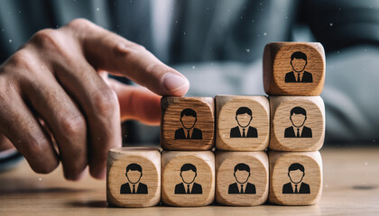 Building staircase of wooden blocks with human icons symbolizes teamwork and leadership in professional setting