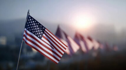 Patriotic American flags waving at sunrise with blurred background