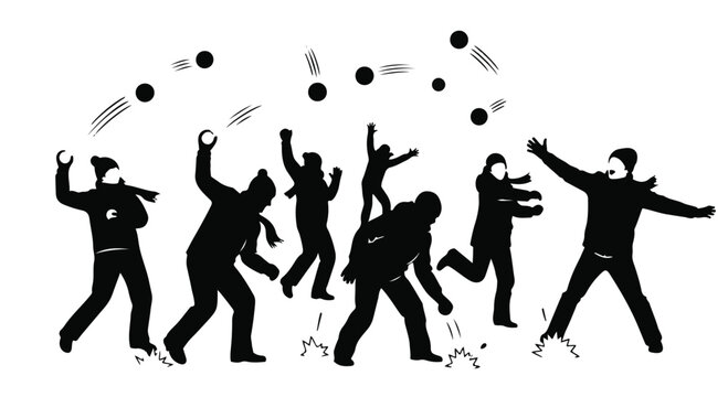 Joyful group of people having a playful snowball fight outdoors in winter