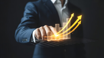 Businessperson touching digital bar chart with upward arrows symbolizing growth and financial success

