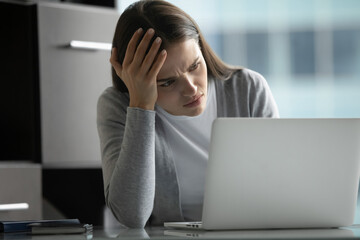 Digital trouble. Nervous confused young businesswoman project manager feel stressed depressed...