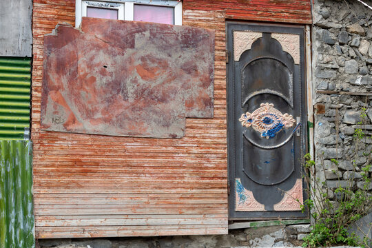 Rustic home in the remote village of Xinaliq in the Caucasus mountains with decorated door