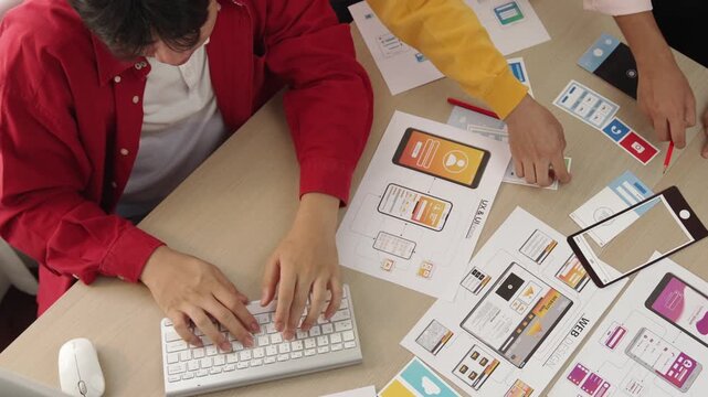 Top view panorama video of startup company employee planning on user interface prototype for mobile application or website in office. UX UI designer brainstorm user friendly interface plan. Synergic