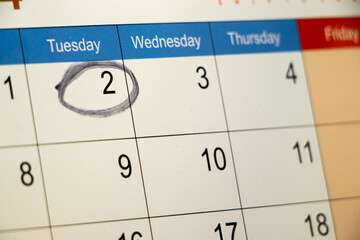 Closeup of circle mark on calender date, business or meeting concept.