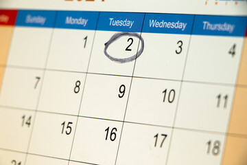 Closeup of circle mark on calender date, business or meeting concept.