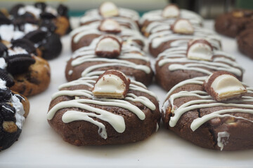 Baked goods with chocolate and cream on display