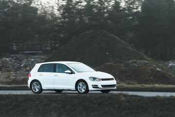Naklejka premium Functional compact car in quiet countryside