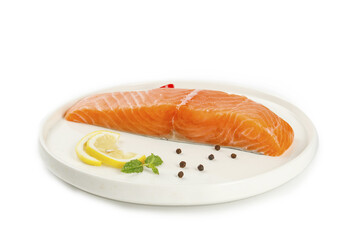Raw Salmon Fillet with Lemon and Peppercorns on White Plate