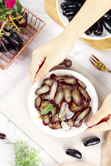 Fresh Sliced Eggplants Still Life with Hands and Vegetables