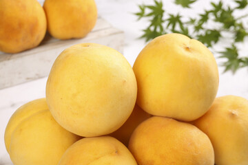 Fresh Yellow Peaches with Green Leaves - Still Life Studio Shot
