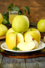 Fresh Yellow Apples - Whole and Sliced on Plate with Juice