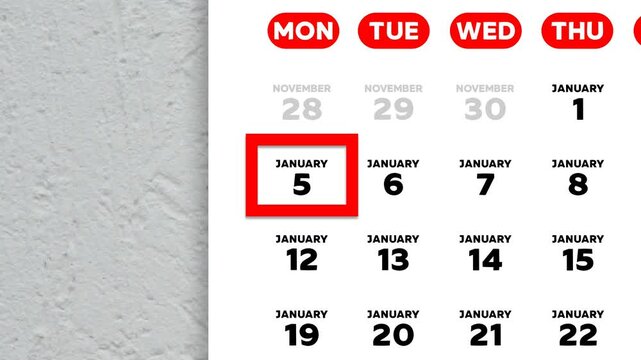 The date January 5th marked with a red cursor on the wall calendar 202