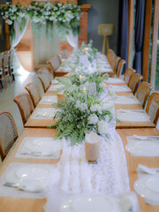 dining table with flower decoration at a wedding event