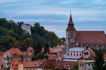 Fototapeta premium Brasov, Romania October 05, 2025. A Stunning Panoramic Perspective of Romania Historic City Nestled in the Carpathian Mountains.