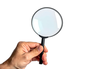 Hand holding magnifying glass for detailed examination, isolated on black