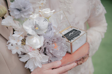 bride holding wedding ring