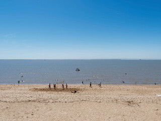 Fouras les Bains. Sporting activity - Volleyball on the sand of the large beach of Fouras facing the Charente estuary. Fort Boyard and the &Icirc;le d'Ol&eacute;ron visible on the horizon