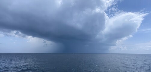 Dramatic Storm Cloud Formation Over Calm Ocean Waters