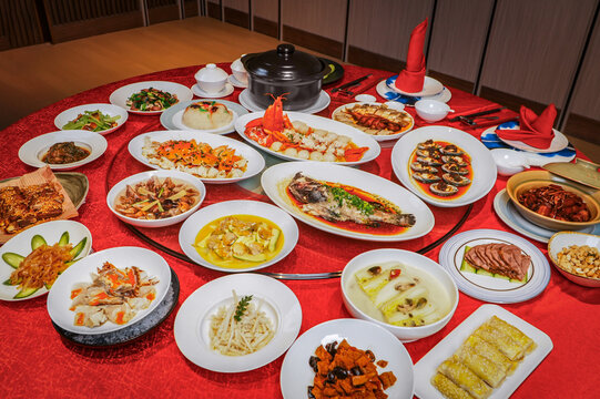 The New Year's Eve dinner table in China, filled with a festive and joyful red atmosphere.