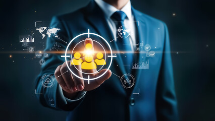 Businessman in blue suit interacting with virtual interface and targeting people icons on glowing screen