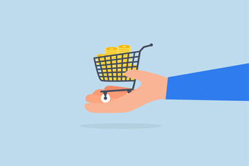 dollar gold coins in shopping cart or trolley in businessman hand