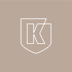 k letter shield protection security logo vector icon illustration