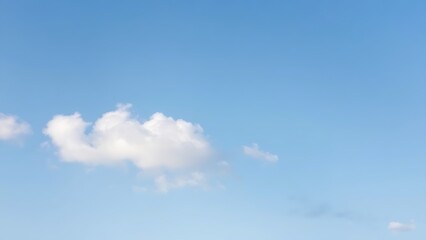 troposphere. Clear blue sky with fluffy white clouds creating a serene minimalistic background. travel magazines, destination branding, designed for outdoor magazines and nature guides.